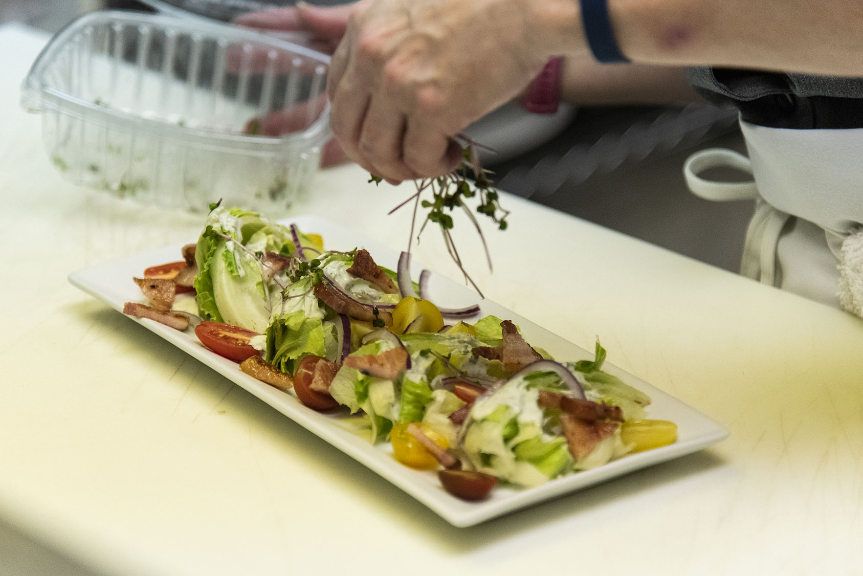 man making a salad